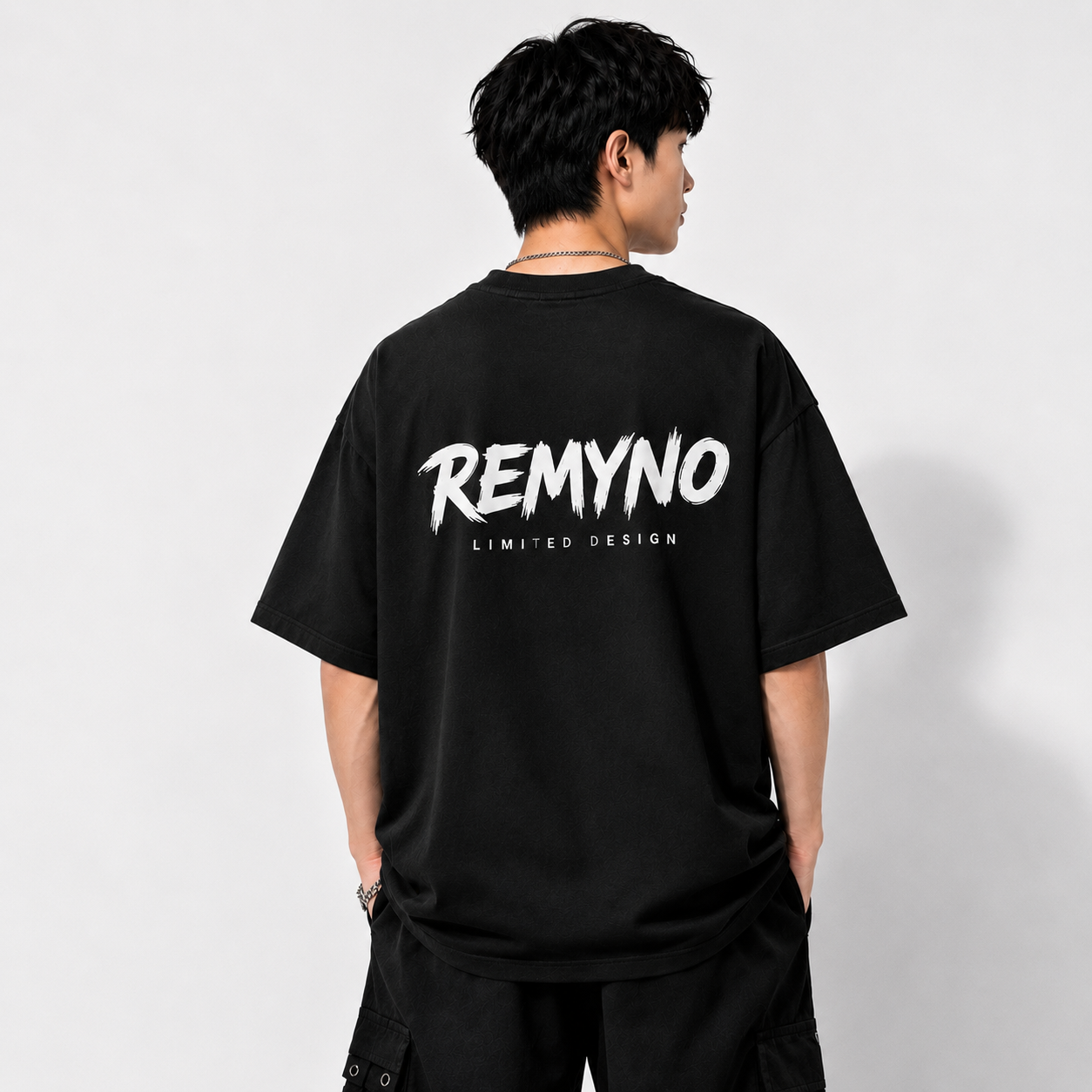 Cotton T-shirt printed with the "REMYNO" brand logo.